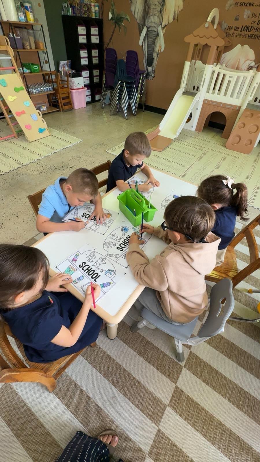 Young students coloring together in a Gospel Light Academy classroom