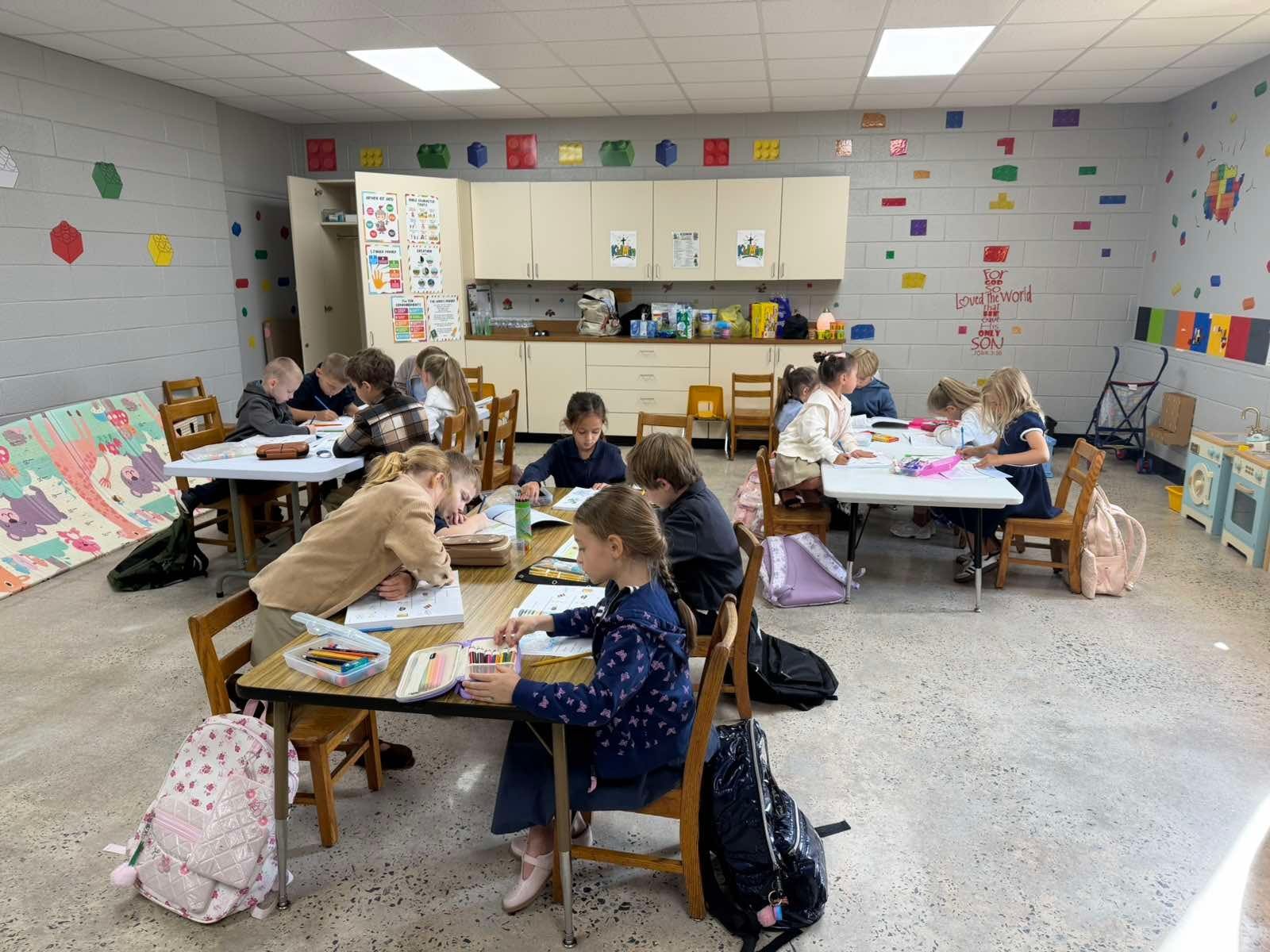 Students working together at classroom tables at Gospel Light Academy